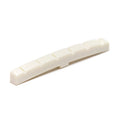 Off-white slotted guitar nut with a curved base and six string slots.