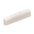 White slotted guitar nut with six slots for strings.