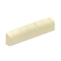 Off-white slotted guitar nut with six string slots on a plain white background.