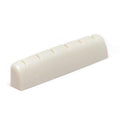 Off-white slotted guitar nut with six string slots visible on top.