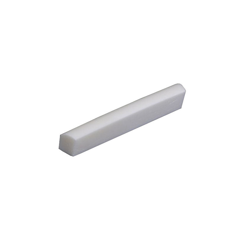 White flat bottom shaped guitar nut part shown on white background