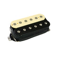 Black and cream humbucker guitar pickup with six metal pole pieces per coil and attached wire.
