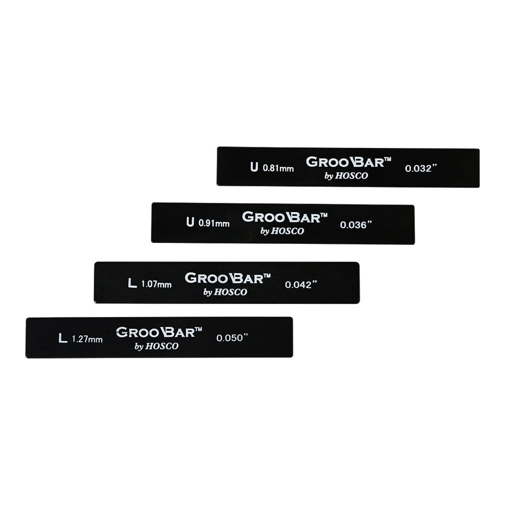 Four black metal GrooBar tool bars with white text showing different thickness measurements in mm and inches.