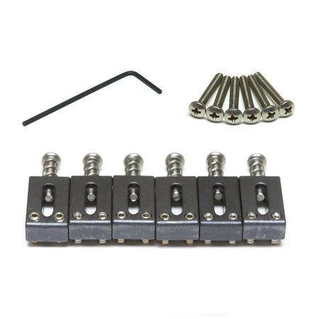 Set of six black metal guitar saddles with six screws and a hex key on a white background.