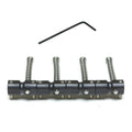 Four black metal guitar saddles with adjustment screws and an L-shaped allen wrench on a white background.