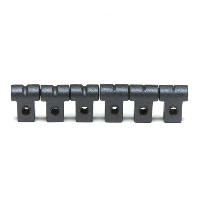 Six black metal string guides with threaded holes aligned in a row on a white background.
