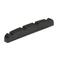 Black slotted guitar nut with four string slots shown on a white background.