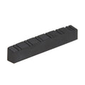 Black rectangular slotted guitar nut or saddle with 12 slots for strings.