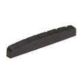 Black slotted flat bottom nut piece for stringed instrument with seven slots visible.