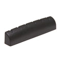 Black slotted guitar nut shown at an angle on a white background.