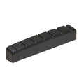 Black plastic slotted guitar nut with seven string slots shown against white background.