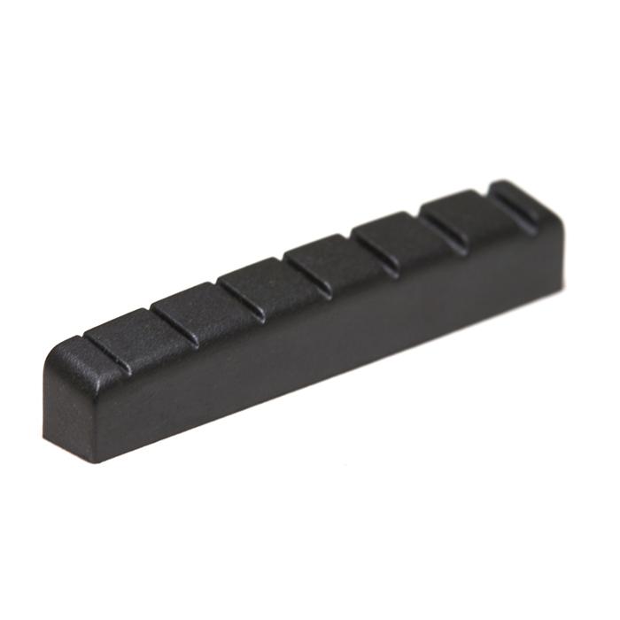 Black plastic guitar nut with seven string slots, shown isolated on a white background.