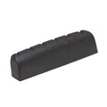 Black plastic guitar nut with six slots on a white background.