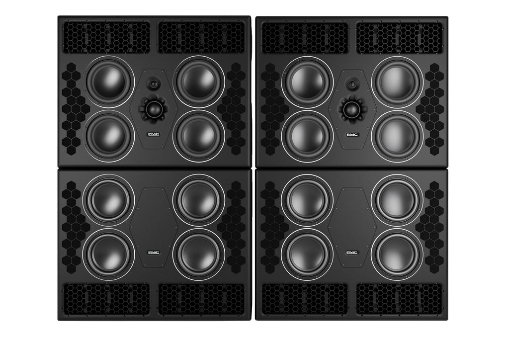 A tall PMC10-4 XBD main studio monitor system built as two stacked rectangular cabinets, the front baffles populated by multiple large circular low-frequency drivers with a smaller soft-dome midrange and tweeter in a central waveguide array.
