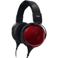 Black and red over-ear wired headphones with padded headband and ear cushions.