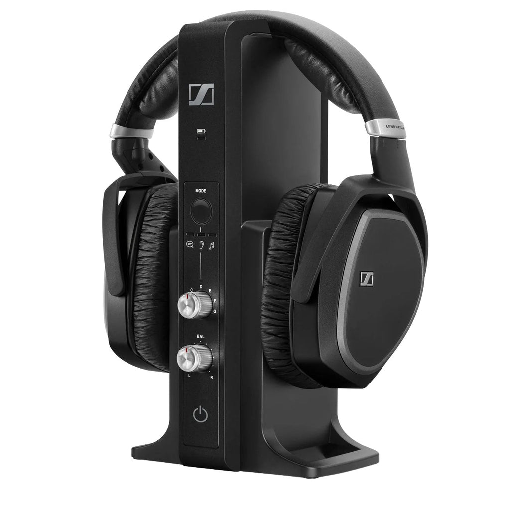 Black over-ear headphones resting on a black vertical docking station with control buttons and knobs.