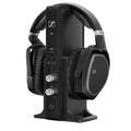 Black over-ear headphones resting on a black vertical docking station with control buttons and knobs.