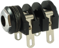 Metal 1/4 inch mono switching jack with four lug terminals and plastic insulating spacers.