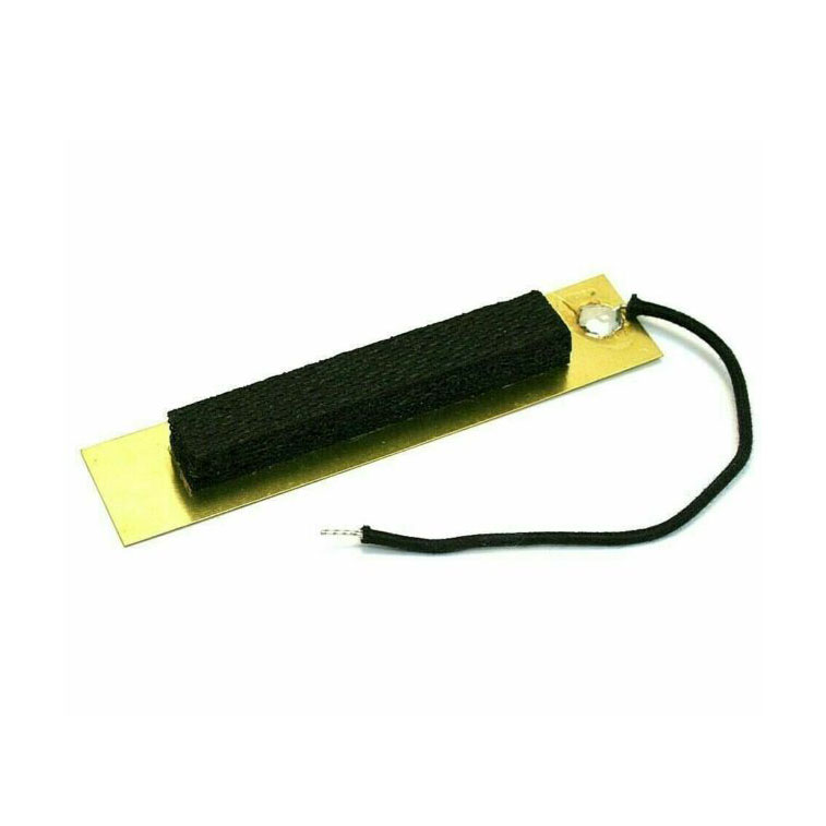 Gold-colored rectangular pickup shield with black fabric foam and attached black wire with bare end.
