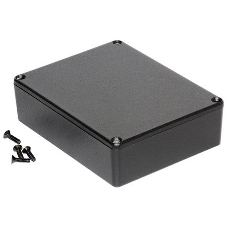 Black rectangular metal enclosure with four screws placed beside it on a white background.
