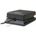 Black rubberized sustain pedal with cable attached and a ridged surface.