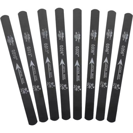Set of eight black metal files with size markings and 'JAPAN MADE' text.
