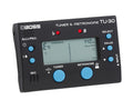 Black Boss TU-30 tuner and metronome device with blue buttons and a digital display showing tuning status.