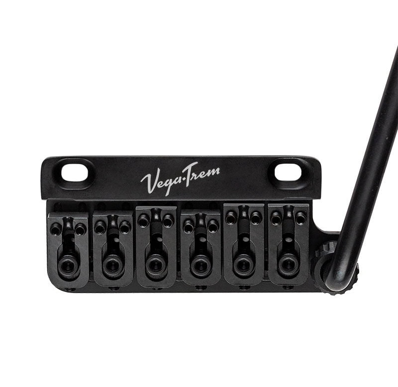 Black VegaTrem guitar bridge with six adjustable string saddles and a tremolo arm on the right side.