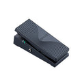 Black expression pedal with textured surface and 1/4 inch jack input, showing illuminated power indicators.