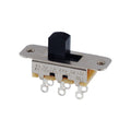 Metal slide switch with black plastic slider and six terminal lugs on cream base