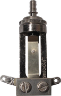 Metal mechanical switch component with two screw terminals and 'SWITCHCRAFT' branding visible.