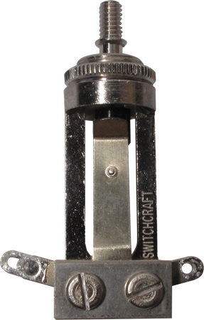 Metal mechanical switch component with two screw terminals and 'SWITCHCRAFT' branding visible.
