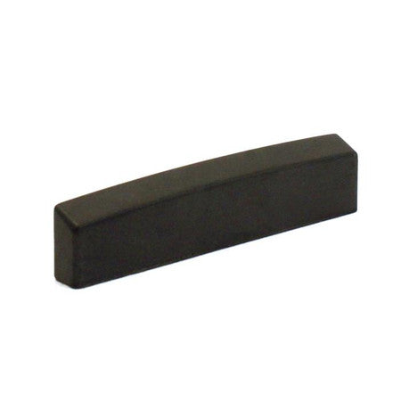 Black rectangular blank guitar nut piece with slightly angled edges on one side.