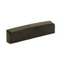 Black rectangular blank nut for guitar with a smooth surface and no slots or markings.