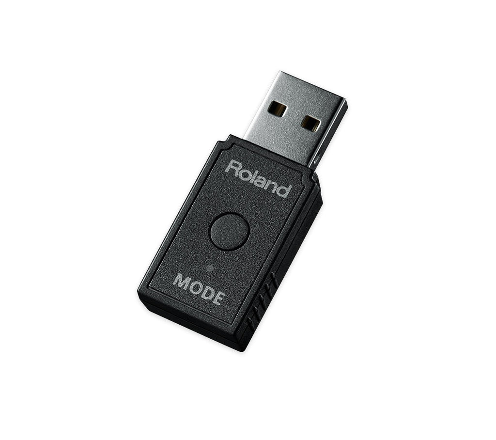 Black wireless USB dongle with a button and USB Type A connector labeled Roland Mode.