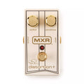 White MXR distortion+ guitar pedal with gold knobs, footswitch, and input/output jacks.