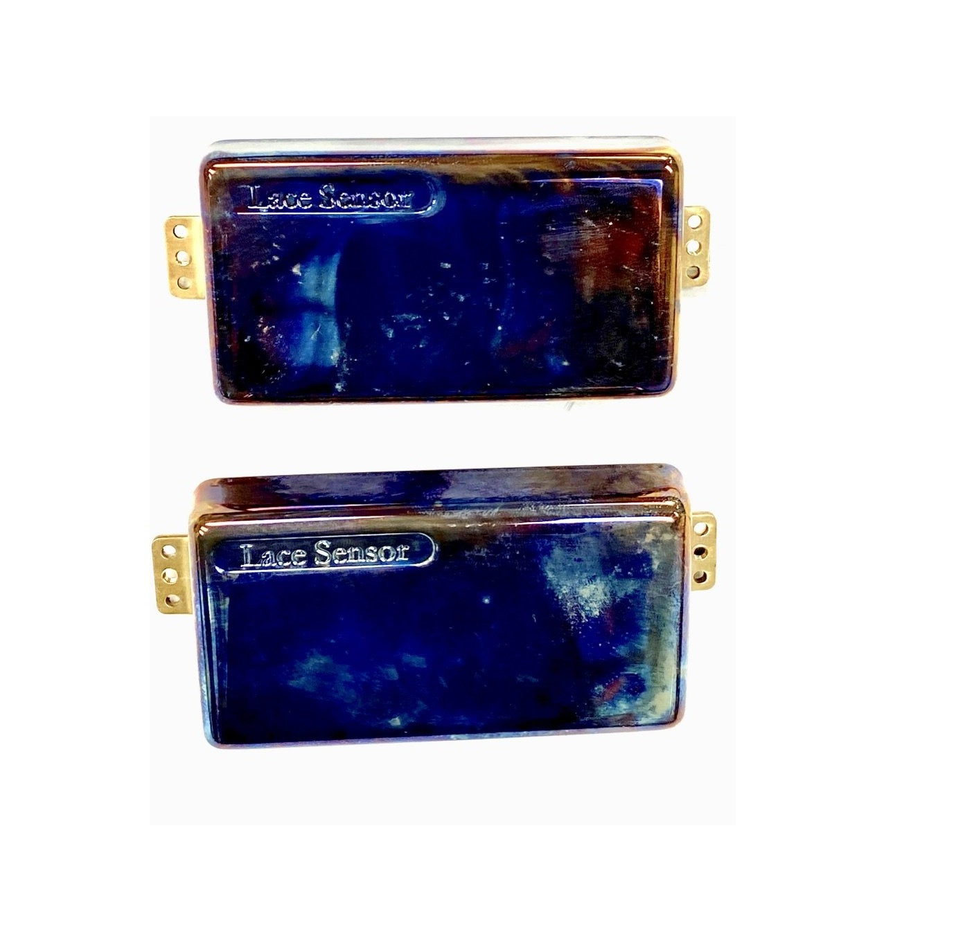 Two rectangular blue metal pickups with gold mounting tabs labeled Lace Sensor on a white background.