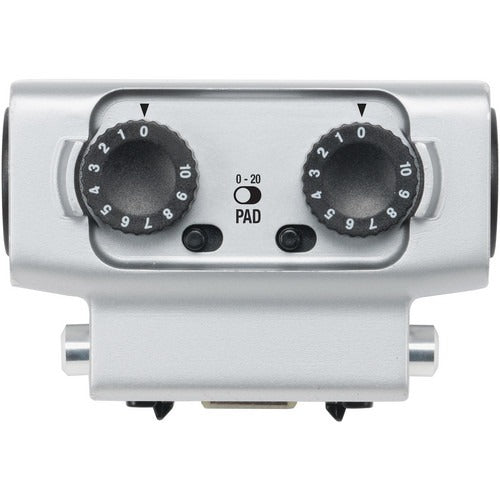 Silver audio device with two black rotary knobs and a toggle switch labeled 0-20 PAD