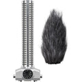 Silver shotgun microphone with a rotary dial and a black furry windscreen next to it on a white background.